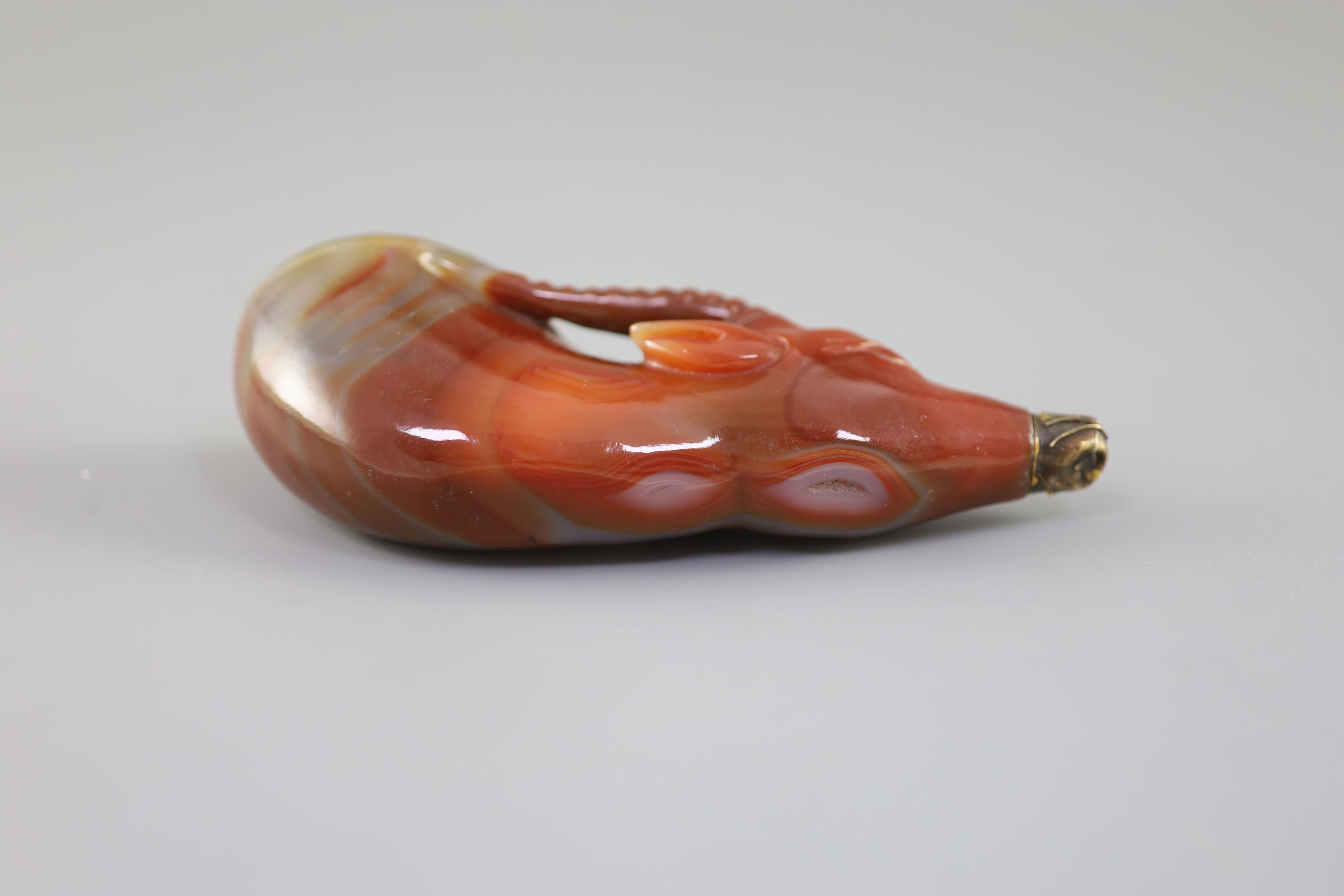A Chinese chalcedony 'antelope' rhyton, late Qing dynasty, 14.5 cm long